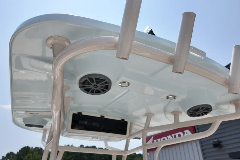 Slide: The Image of 2027 Carolina Skiff 21LS boat top view with speakers and rod holders. - 11