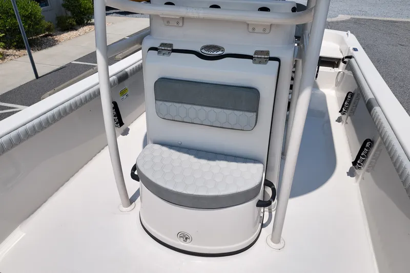 Slide: The Image of 2027 Carolina Skiff 21LS boat interior with cushioned seating and storage. - 12