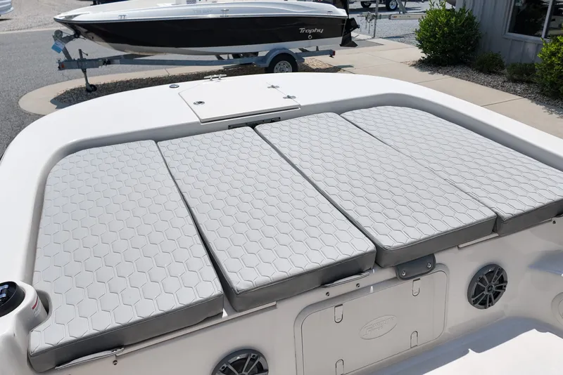 Slide: The Image of 2027 Carolina Skiff 21LS boat with cushioned seating and storage compartments. - 20