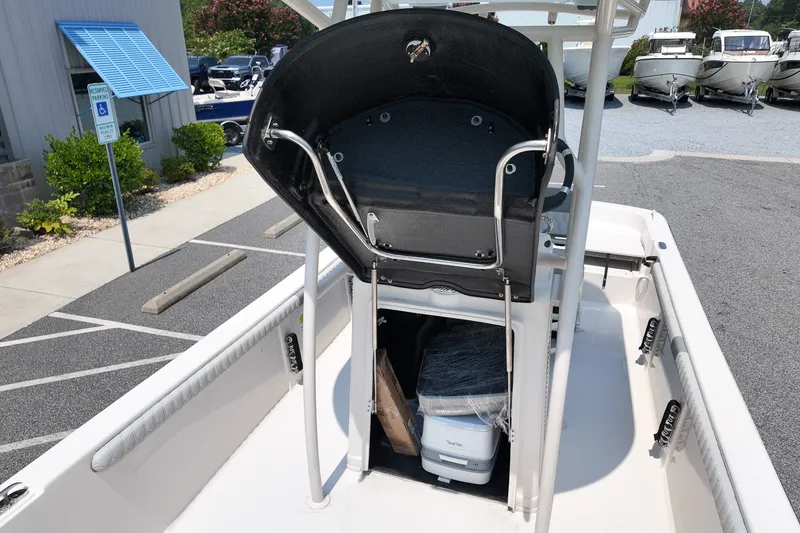 Slide: The Image of 2027 Carolina Skiff 21LS boat interior with storage compartment and seating. - 13