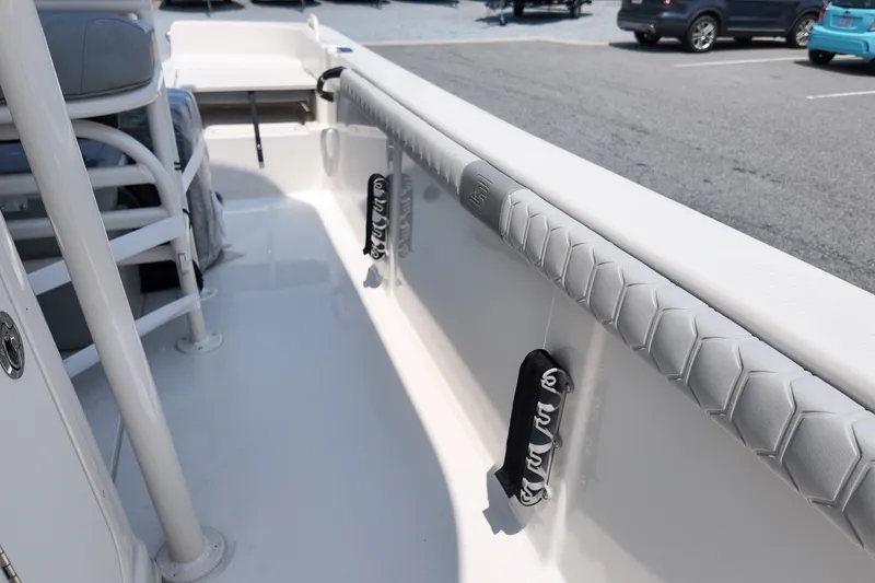 Slide: The Image of 2027 Carolina Skiff 21LS boat interior with padded rails and seating. - 16