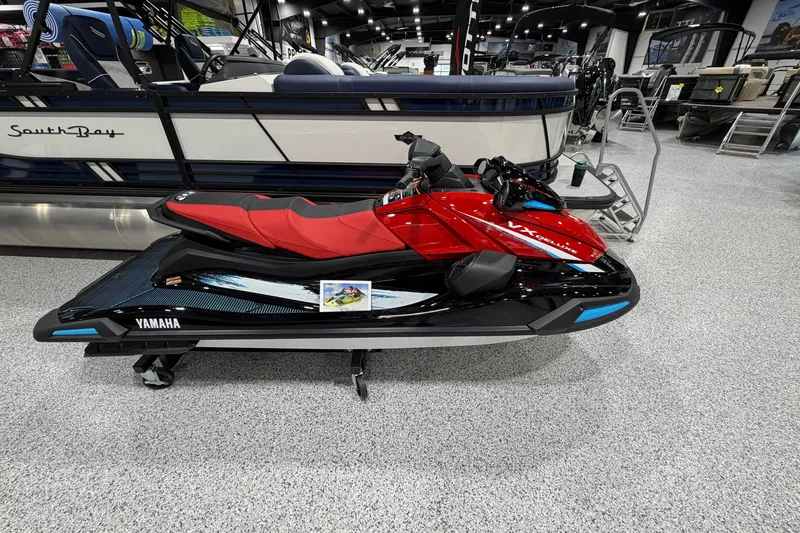 The Image of A red 2026 Yamaha WaveRunner VX Deluxe is displayed in a showroom. - 1