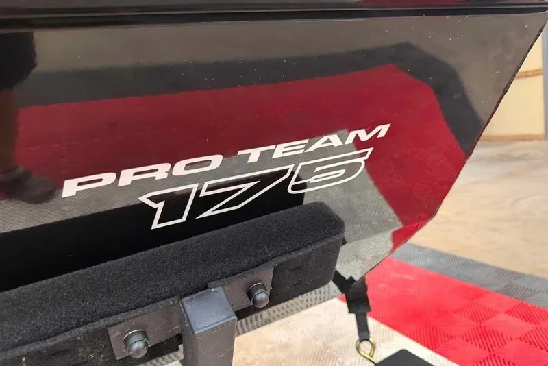 Slide: The Image of 2027 Tracker Pro Team 175 boat logo on a sleek black surface. - 9