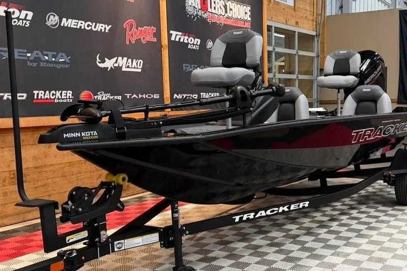 Slide: The Image of 2027 Tracker Pro Team 175 boat displayed indoors on a checkered floor. - 5