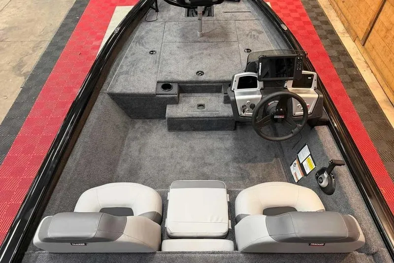 Slide: The Image of 2027 Tracker Pro Team 175 boat interior with dual seats and steering console. - 2
