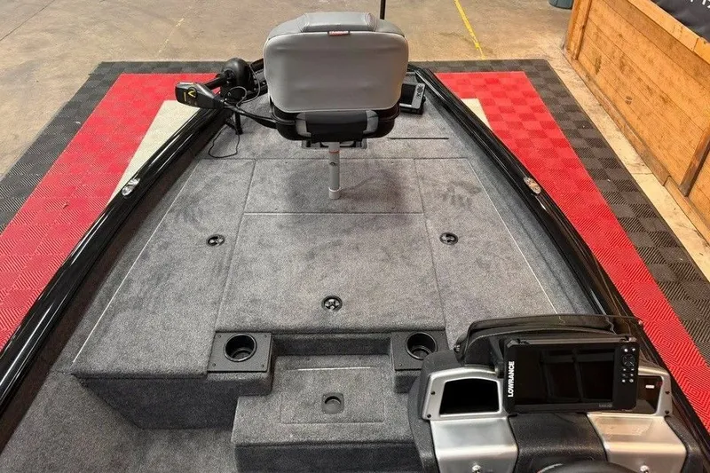Slide: The Image of 2027 Tracker Pro Team 175 boat interior with gray seating and fishing equipment. - 7