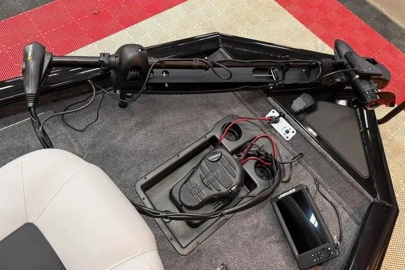 Slide: The Image of 2027 Tracker Pro Team 175 boat deck with trolling motor and fish finder. - 6