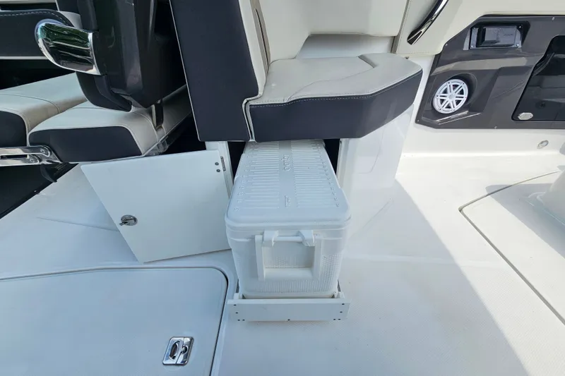 Slide: The Image of 2022 Monterey 255SS Super Sport boat interior with cooler storage under seat. - 22