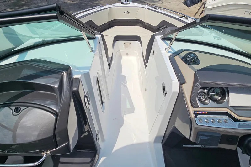 Slide: The Image of 2022 Monterey 255SS Super Sport boat interior with sleek dashboard and seating area. - 20