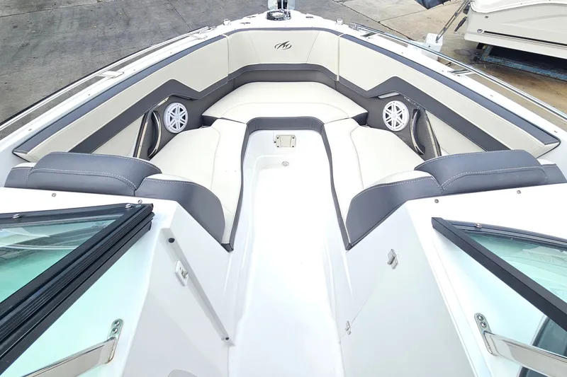 Slide: The Image of 2022 Monterey 255SS Super Sport boat interior with cushioned seating and speakers. - 15