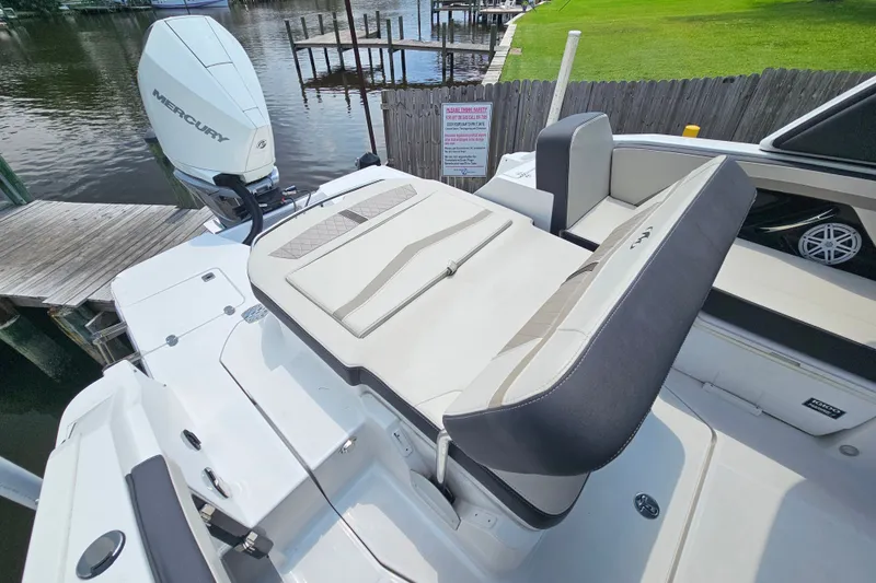 Slide: The Image of 2022 Monterey 255SS Super Sport boat with Mercury engine, docked by a wooden pier. - 28