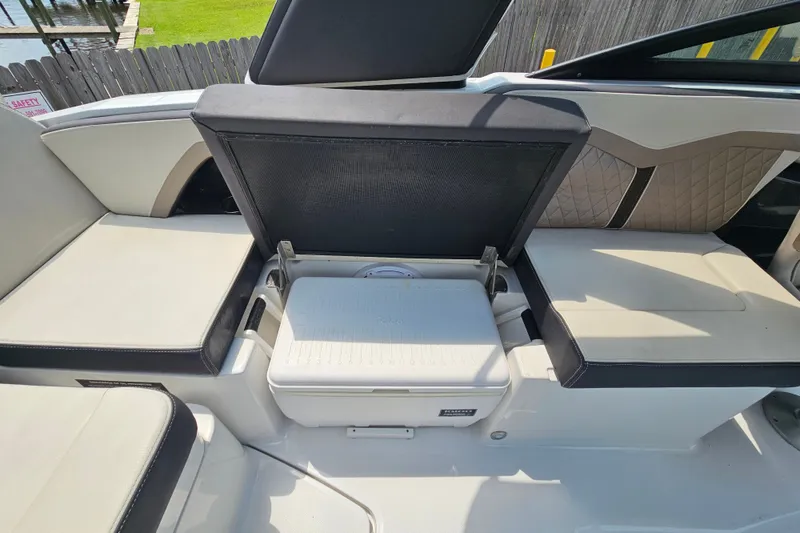 Slide: The Image of 2022 Monterey 255SS Super Sport boat interior with open storage compartment. - 21