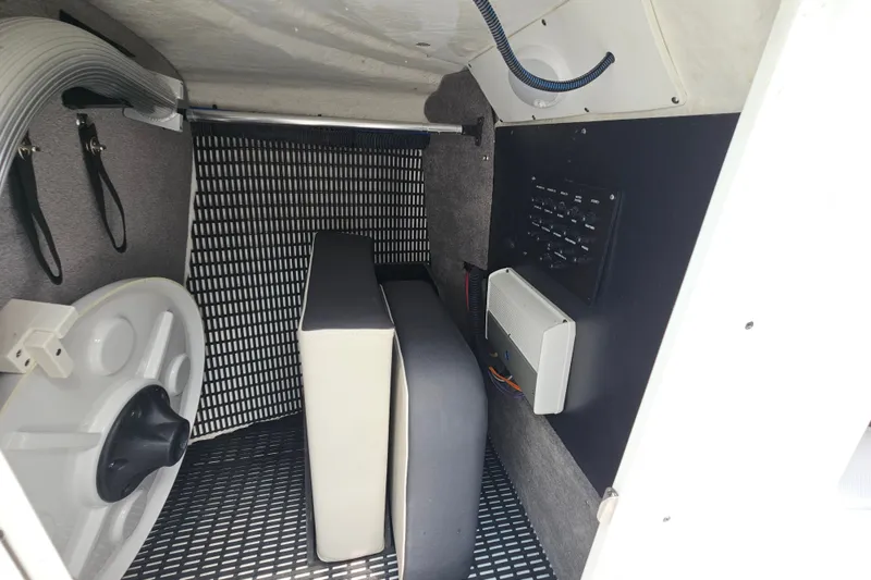 Slide: The Image of Interior of 2022 Monterey 255SS Super Sport boat showing storage and control panel. - 17
