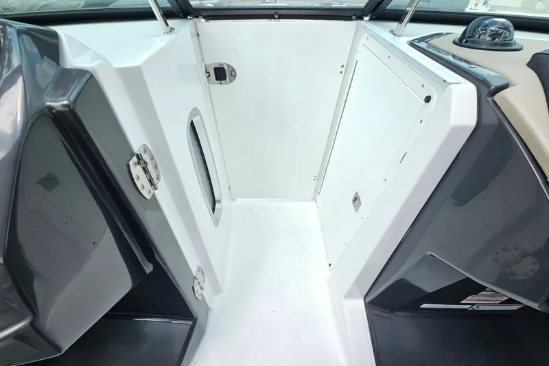 Slide: The Image of 2022 Monterey 255SS Super Sport boat interior with sleek white and gray design. - 16