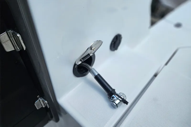 Slide: The Image of Close-up of a 2022 Monterey 255SS Super Sport boat's fuel cap and hinge detail. - 24