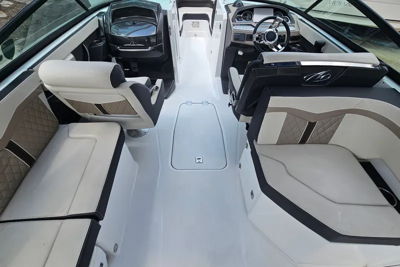 Slide: The Image of 2022 Monterey 255SS Super Sport boat interior with luxurious seating and modern dashboard. - 25