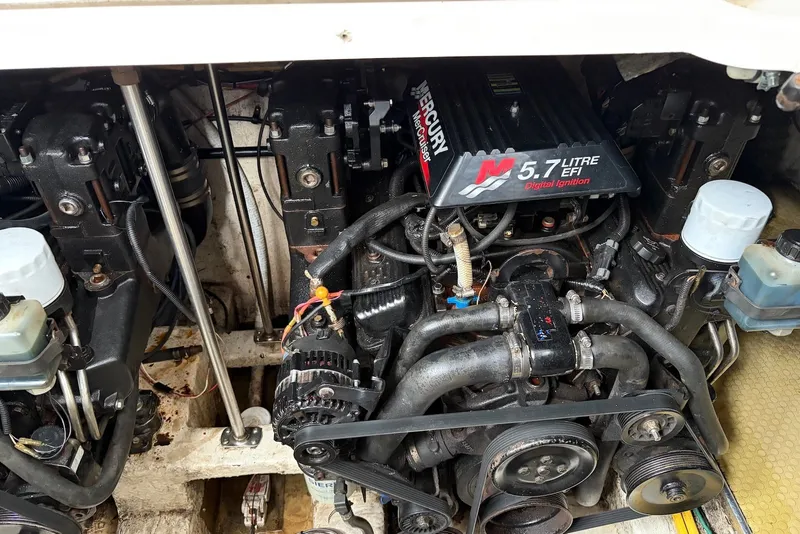 Slide: The Image of Engine compartment of a 2001 Larson Cabrio 330 with a 5.7L EFI Mercury engine. - 17