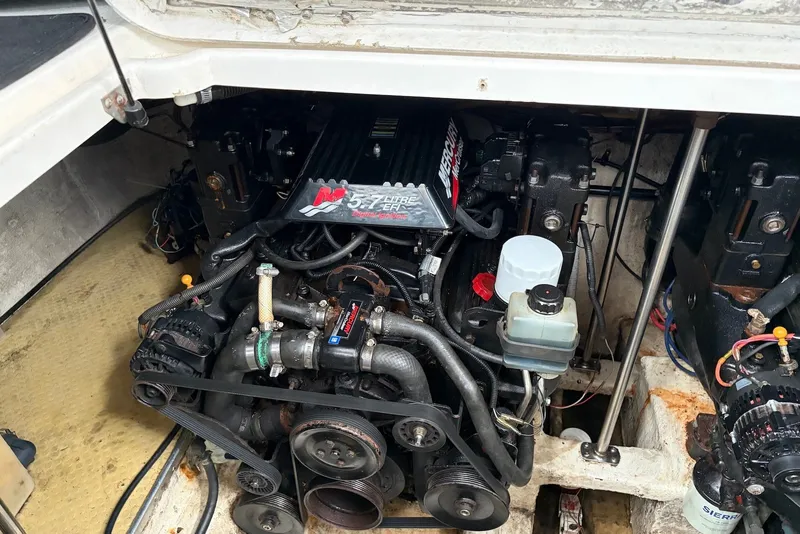 Slide: The Image of Engine compartment of a 2001 Larson Cabrio 330 boat, featuring a Mercury MerCruiser engine. - 18