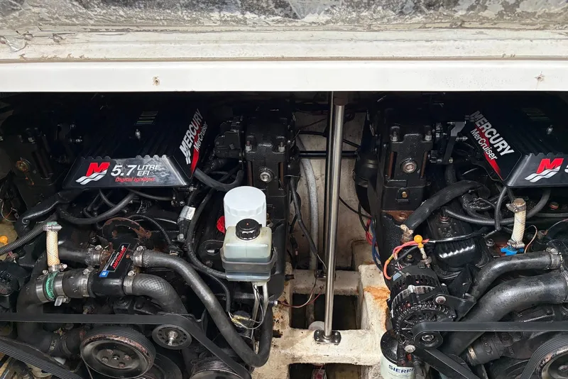 Slide: The Image of Engine compartment of a 2001 Larson Cabrio 330 with twin Mercury 5.7L EFI engines. - 16