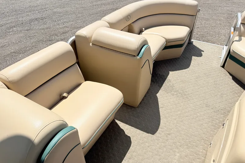 Slide: The Image of 2015 South Bay 520CR boat interior with beige seating and carpeted floor. - 5