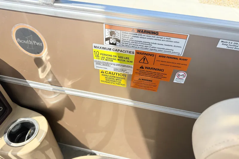 Slide: The Image of Safety warnings and capacity limits on a 2015 South Bay 520CR boat. - 8