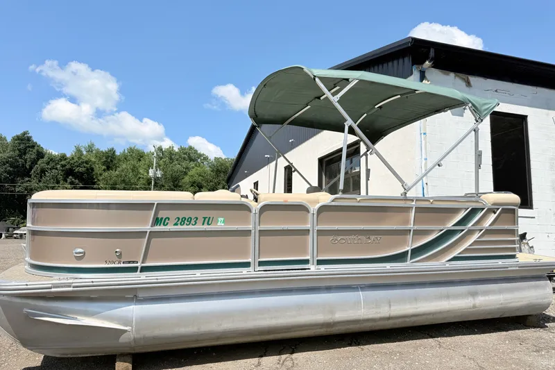 The Image of 2015 South Bay 520CR pontoon boat with canopy, parked outdoors. - 0