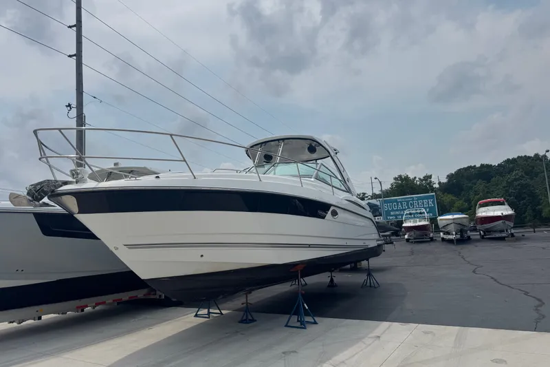 Slide: The Image of 2018 Monterey 355 Sport Yacht on display at a marina, under a cloudy sky. - 2