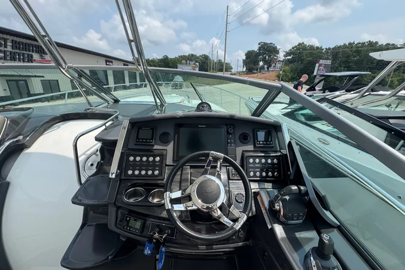 Slide: The Image of Cockpit view of 2018 Monterey 355 Sport Yacht with modern controls and steering wheel. - 12