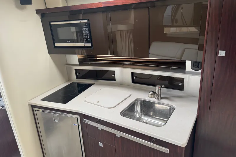 Slide: The Image of Kitchen area of a 2018 Monterey 355 Sport Yacht with modern appliances. - 14