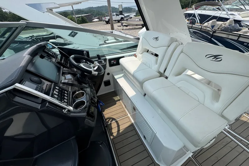 Slide: The Image of 2018 Monterey 355 Sport Yacht cockpit with modern controls and white seating. - 11