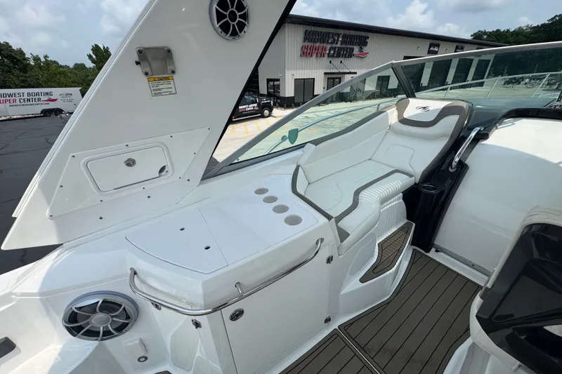 Slide: The Image of 2018 Monterey 355 Sport Yacht interior with white seating and modern dashboard. - 9