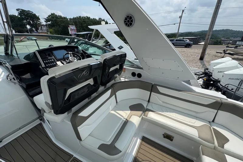 Slide: The Image of 2018 Monterey 355 Sport Yacht interior with helm, seating, and modern dashboard. - 8