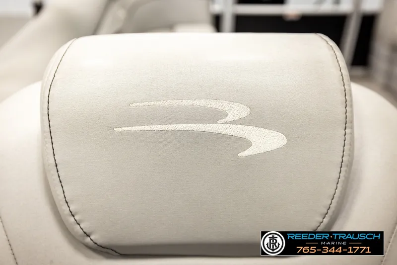 Slide: The Image of 2021 Bennington SVSR boat seat with embroidered logo, Reeder-Trausch Marine contact details visible. - 42