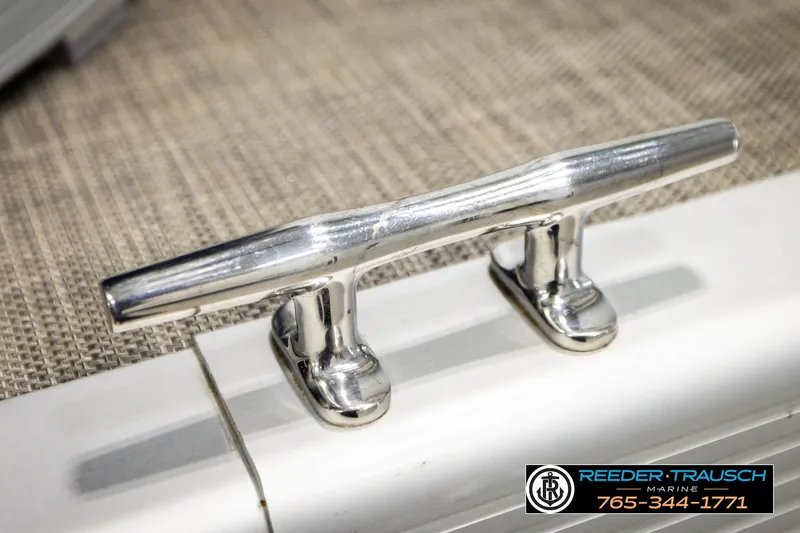 Slide: The Image of Chrome cleat on 2021 Bennington SVSR boat, displayed on textured surface. - 54