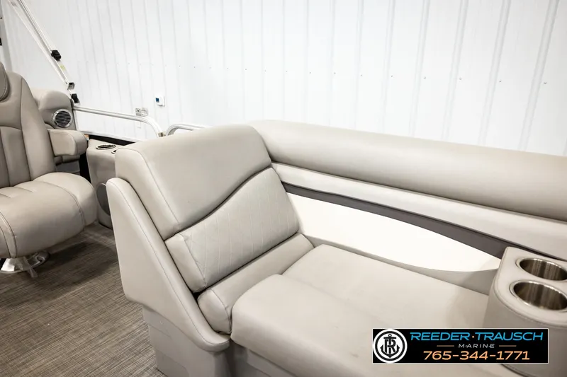 Slide: The Image of 2021 Bennington SVSR boat interior with plush seating and cup holders. - 24
