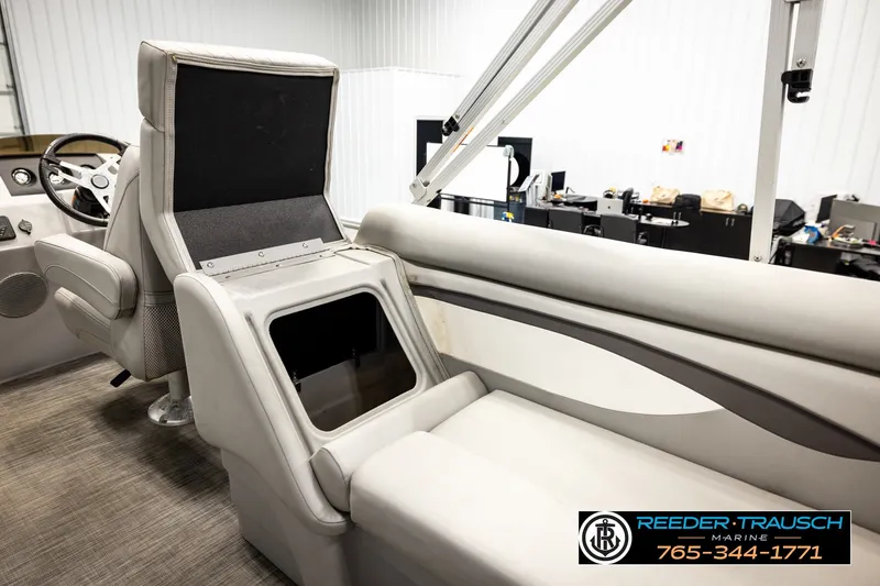 Slide: The Image of Interior of a 2021 Bennington SVSR boat with open storage compartment. - 27