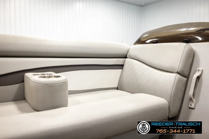 Slide: The Image of 2021 Bennington SVSR boat interior with beige seating and cup holders. - 43