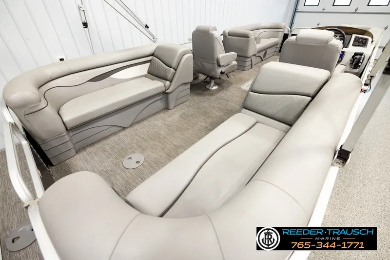 Slide: The Image of Interior of a 2021 Bennington SVSR pontoon boat with luxurious seating and modern design. - 12
