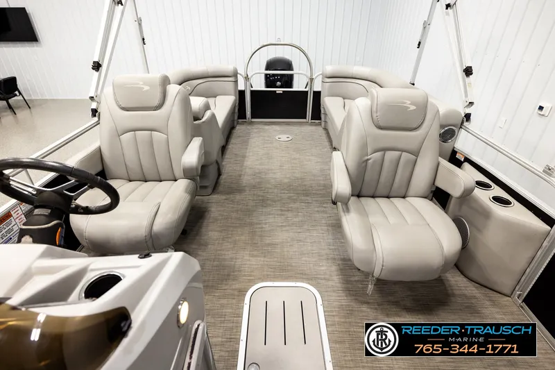 Slide: The Image of 2021 Bennington SVSR pontoon boat interior with plush seating and modern design. - 14