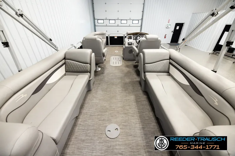 Slide: The Image of 2021 Bennington SVSR pontoon boat interior with luxurious seating and modern design. - 16