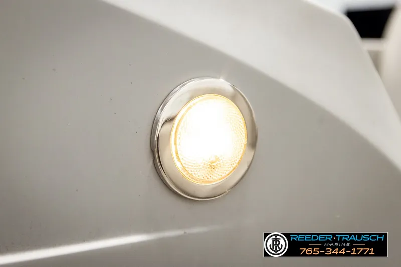 Slide: The Image of Close-up of a 2021 Bennington SVSR boat light with Reeder Trausch Marine logo. - 44