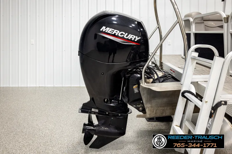 Slide: The Image of 2021 Bennington SVSR with Mercury outboard motor in showroom setting. - 47