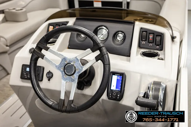 Slide: The Image of 2021 Bennington SVSR boat dashboard with steering wheel and control panel. - 30