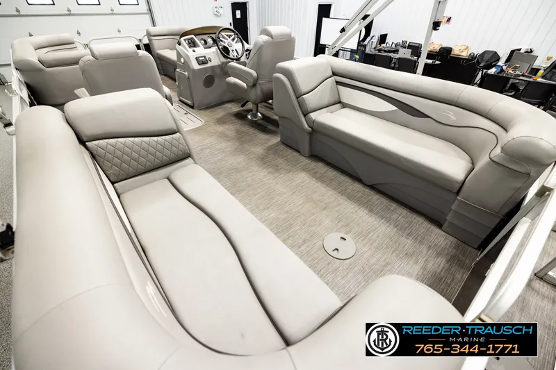 Slide: The Image of Luxurious interior of a 2021 Bennington SVSR pontoon boat with plush seating. - 11