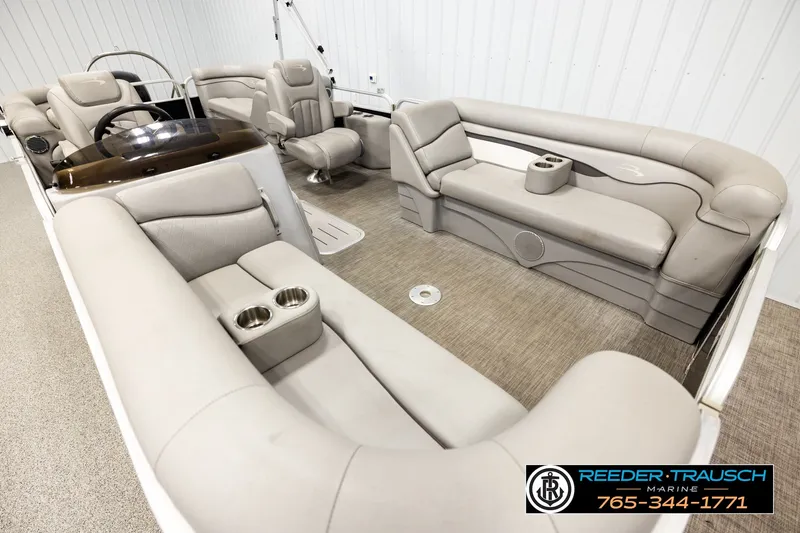 Slide: The Image of Luxurious interior of 2021 Bennington SVSR pontoon boat with plush seating and cup holders. - 9