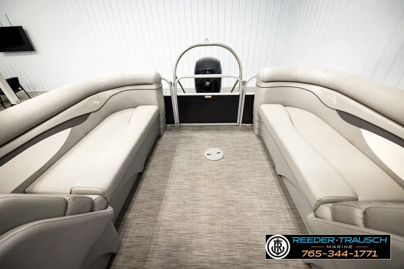 Slide: The Image of 2021 Bennington SVSR pontoon boat interior with beige seating and carpeted floor. - 22