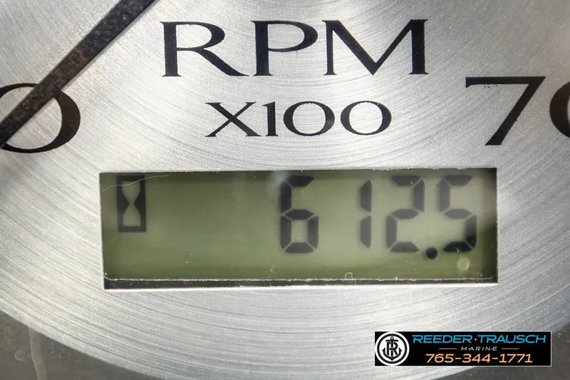 Slide: The Image of Close-up of a Bennington SVSR 2021 RPM gauge displaying 612.5, with Reeder-Trausch Marine logo. - 37