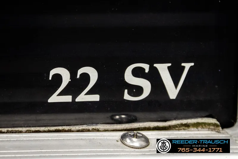 Slide: The Image of Close-up of 2021 Bennington SVSR boat model number '22 SV' with Reeder-Trausch Marine logo. - 52