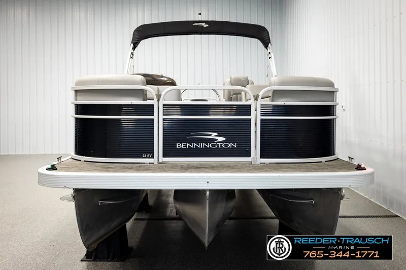 Slide: The Image of 2021 Bennington SVSR pontoon boat in showroom, front view. - 8