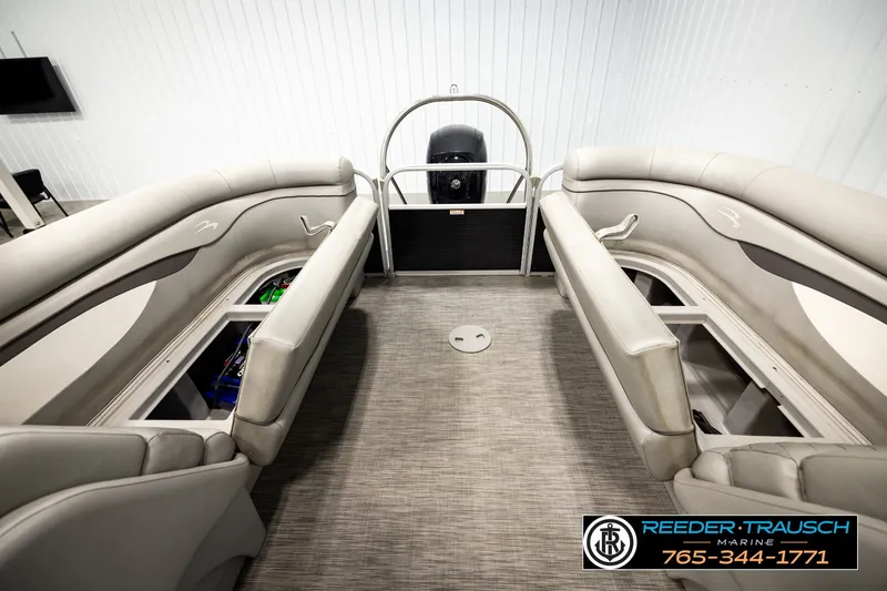Slide: The Image of 2021 Bennington SVSR boat interior with spacious seating and storage compartments. - 23